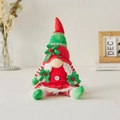 Weihnachtliche Wichtelpuppe mit rot-grünen Streifen, Zöpfen und grünem Polka-Dot-Hut - Sitzende Frau