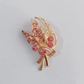 Elegant gold flower bouquet brooch featuring sparkling pink rhinestones in a modern design - Pink Streamline Bouquet