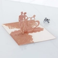 Macro detail of rose gold glitter wedding card with 3D laser cut Mr & Mrs silhouette - Glitter Champagne Gold