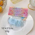 Light blue slipper-shaped squishy toy from the Pinch Family series in a clear package - Blue Slipper