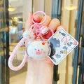 Pink cat plush keychain with silicone wristband and cute bell accessory for bags - Acrylic Big Head - White Cat
