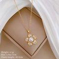 Detail of gold floral necklace with white pearl and zircons in a jewelry box - Necklace (C145)