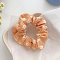 Orange mesh hair scrunchie with daisy print and ruffled fabric texture for women - Orange Floral