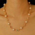 Golden necklace featuring white pearls and colorful faceted gemstone flower pendants - Vintage Carved Pearl Gemstone Necklace / Gold Color (2814)