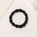 Close-up of black braided elastic hair tie with a sleek polished resin connector piece - Braided Twist - Plastic Buckle / Black