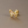Detailed macro view of a gold butterfly piercing with colorful zircons and ball screw back - Colorful Stone Butterfly-E1360-1