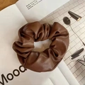 Detailed close-up of dark coffee PU leather scrunchie with elegant pleated texture - Dark Coffee