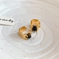 Close-up of vintage gold plated hoop earrings with tiger eye stone on white ceramic tray - Gold and Coffee Ear Clips (14K Gold Plated)