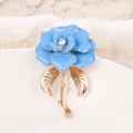 Macro view of blue enamel rose brooch with gold metal stem and clear rhinestone center - XD9418-3 Blue Rose