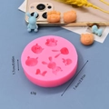 Pink silicone mold for cartoon bear and rabbit shapes with orange and blue resin samples - Multi-Hole Cartoon Animal Collection Style (3)