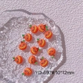 Detail view of 11 mini 10x12mm resin Halloween pumpkin charms for nail art and DIY crafts - YD-697# Orange Pumpkin
