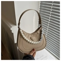 Detail of khaki hobo bag featuring embossed heart pattern with pearl and silver chains - Khaki