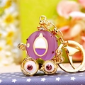 Golden keychain featuring a purple rhinestone pumpkin carriage with pink and white crystals - Jelly Pumpkin Carriage Purple