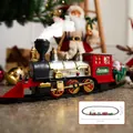Elektrisches Weihnachtszug-Set mit Dampflokomotive und festlichen Wagen auf Schienen - Weihnachtszug (Boden)