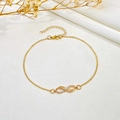 Elegant gold infinity symbol anklet with crystal accents on a soft silk background - Rhinestone Infinity Anklet (KC金 K-884)