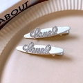 Pair of silver hair clips with sparkling rhinestones in a sleek oval metal frame - Silver Rhinestone Letter Hair Clip - One Pair (159#)