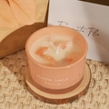 Pink glass scented candle jar with orange crystal stones on wooden coaster - Coco Scent / Pink