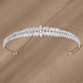 Elegant silver crown headband featuring marquise-cut zircons in a leaf design on beige background - Silver TS-J3220S