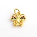 Macro detail of gold butterfly pendant with vibrant multi-color zircon gemstones - Red Green Orange Zirconia Gold Butterfly Style (10)
