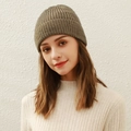 Olive green vertical knit beanie for winter made of soft wool displayed on a model - Mocha Brown