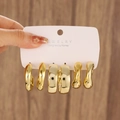 Set di tre paia di orecchini d'oro con cerchi lisci, piatti e intrecciati su scheda - Oro (N-833)