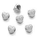 Macro shot of silver heart-shaped spacer beads with spiral texture for jewelry making - Silver Style 16 (Heart)