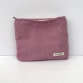 Pink corduroy makeup bag detail showing texture, zipper, and May Rabbit label - Lotus Pink