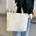 Minimalist large white canvas tote bag for women shown as a stylish shoulder bag - Blank / White