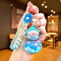 Detail of cute luminous floating pig keychain with blue liquid glitter and silicone strap - Gradient Rope [blue] Glow-in-the-dark Pvc Peach