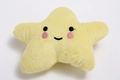 Star-shaped squeaky plush dog toy in yellow with embroidered smiley face detail - Yellow Star Shape