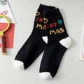Calze di Natale nere in cotone con punte bianche e stampa colorata di scritte festive - Taglia unica / Nero