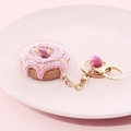 Handmade pink crochet donut keychain with sprinkles and a gold bell charm - Donut-Pink