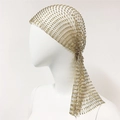Detail of a sparkling gold rhinestone mesh headpiece with cascading side fringes for parties - Short Style / Gold