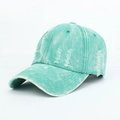 Detailed macro shot of mint green washed denim baseball cap with vintage distressed effects - Adjustable / Light Green