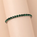 Classic stainless steel tennis bracelet with vibrant deep green round-cut crystals - 18cm / Green