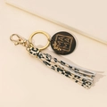Detail of wooden MAMA pendant with leopard print faux leather tassel keychain accessory - Yellow Leopard