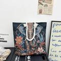 Ethnic blue tote bag featuring colorful elephant embroidery and white woven rope handles - Dark Night Pink Elephant