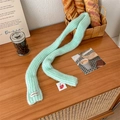 Soft mohair knit scarf in mint green featuring a minimalist vegetable label and heart tag - Teal Blue