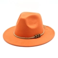 Detailed view of orange wool fedora featuring beige braided rope and bronze beads - Orange