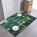 Modern emerald green rectangle entryway mat with gold geometric marble patterns on wood floor - Planet