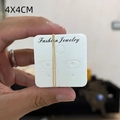 Close-up of 4x4cm white cardboard jewelry display cards for earrings and necklaces - Earring Card #12 (Approx. 100Pcs)