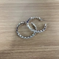 Silver C-shape hoop earrings with colorful zircon stones on a wooden background - Wave (ES2769-4)