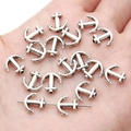 Silver anchor alloy pendants for DIY jewelry making shown on a hand palm for scale - Anchor / 10x10mm