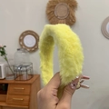 Detail of yellow plush headband featuring a soft fuzzy texture and minimalist design - Yellow