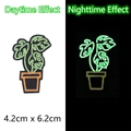 Luminous Monstera plant embroidery patch showing daytime and nighttime glow effects - Potted Plant Style (GZ-05548-7) / 4.2cm x 6.2cm