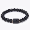 Detail of matte black onyx beads with rose gold Capricorn zodiac cylinder charm - Capricorn