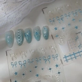 Detailed view of Co-523 nail art stickers with 3D ice blue bows and star patterns - Ice Blue Bow and Pearl Style (CO-523)