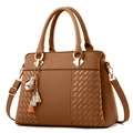Dark brown women's faux leather handbag with braided texture and floral tassel charm - Earthy Yellow