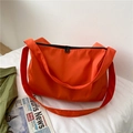 Large capacity orange nylon crossbody gym bag with black zipper detail for sports - Orange