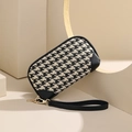 Elegant black and white houndstooth clutch bag with golden zipper and wrist strap - Black and White